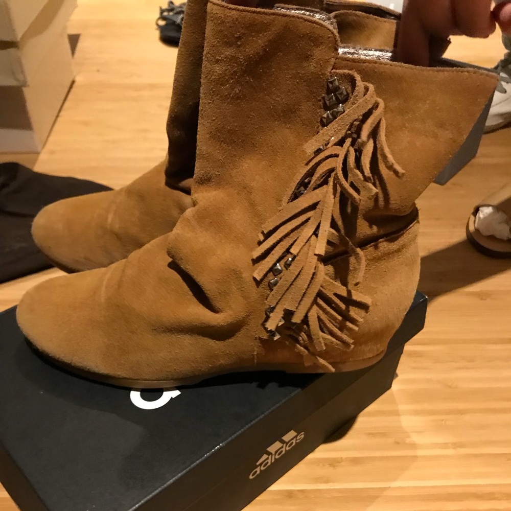 Rivet and tassel trim boots.